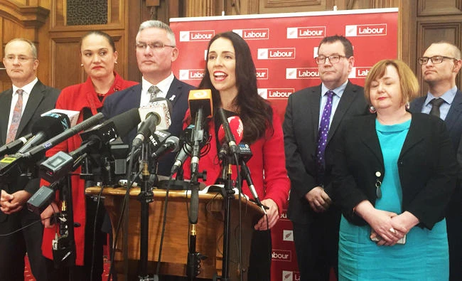 Jacinda Ardern (C), New Zealand's new opposition Labour leader, speaks to the press alongside members of her party after Andrew Little stepped down in Wellington, New Zealand, on Tuesday. (REUTERS)