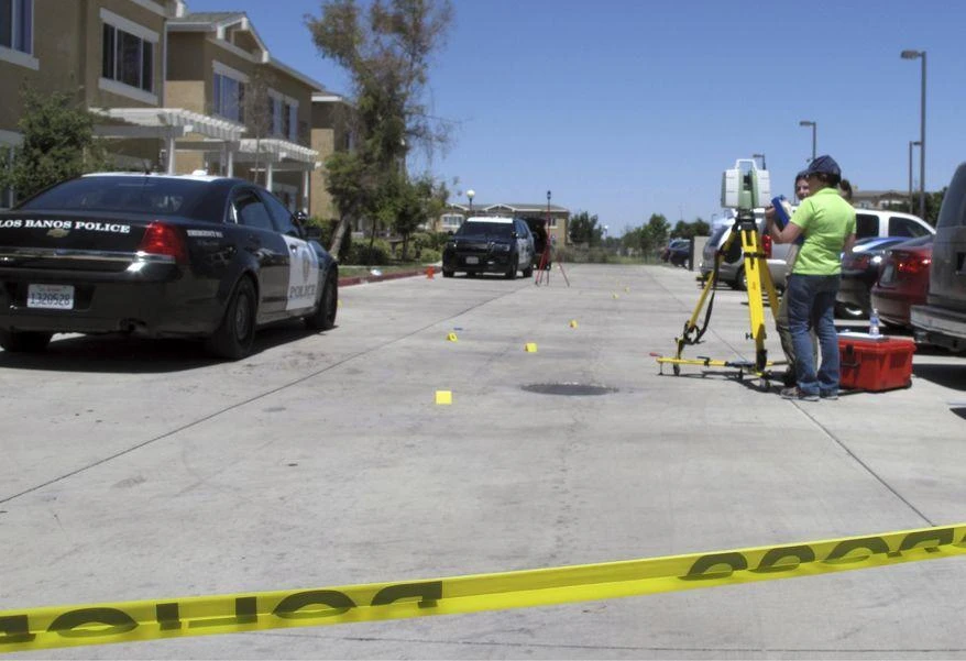 Investigators check a crime scene where two police officers and a burglar were shot on Monday, July 31, 2017, at an apartment complex in Los Banos, Calif. Authorities say the two police officers and a burglary suspect were shot in a struggle that erupted when the officers responded to a break-in report at the apartment. (AP)