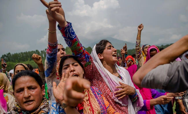 Kashmiri village women shout pro-Pakistani and pro-freedom slogans during the funeral procession of senior militant Arif Nabi Dar in Lilhar, about 35 km south of Srinagar, Indian controlled Kashmir, Tuesday. (AP)