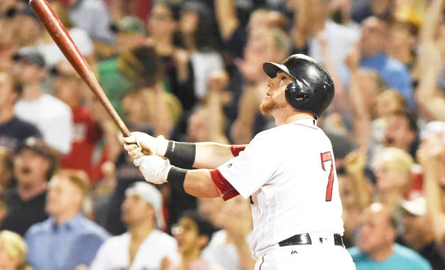 Boston Red Sox catcher Christian Vazquez watches his walk-off home run during the ninth inning against the Cleveland Indians at Fenway Park Tuesday. (USA TODAY Sports)