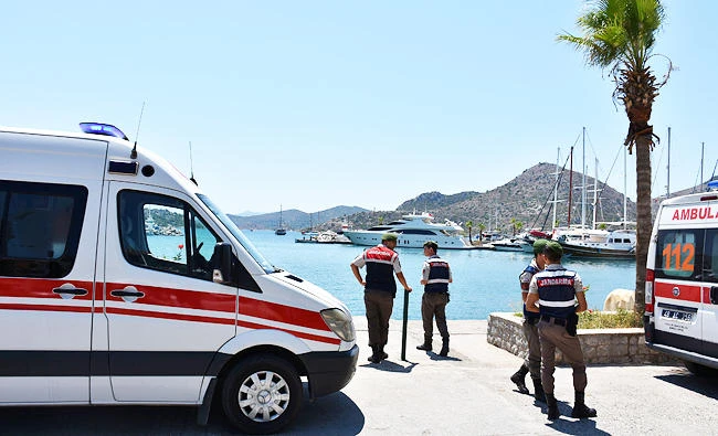 Turkish gendarmes stand next to ambulances in the resort town of Marmaris in Mugla province, Turkey, on Wednesday. (REUTERS)