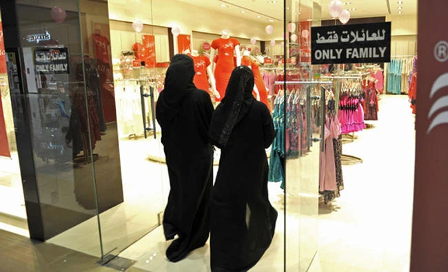 Fully-veiled Saudi women enter a lingerie shop for women and families only in the Saudi Red Sea port of Jeddah, in this file photo taken on January 2, 2012. (AFP)