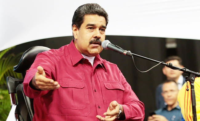 Handout photo released by the Venezuelan presidency showing President Nicolas Maduro (L) talking during a meeting with constitutionalists in Caracas on Wednesday. (AFP)