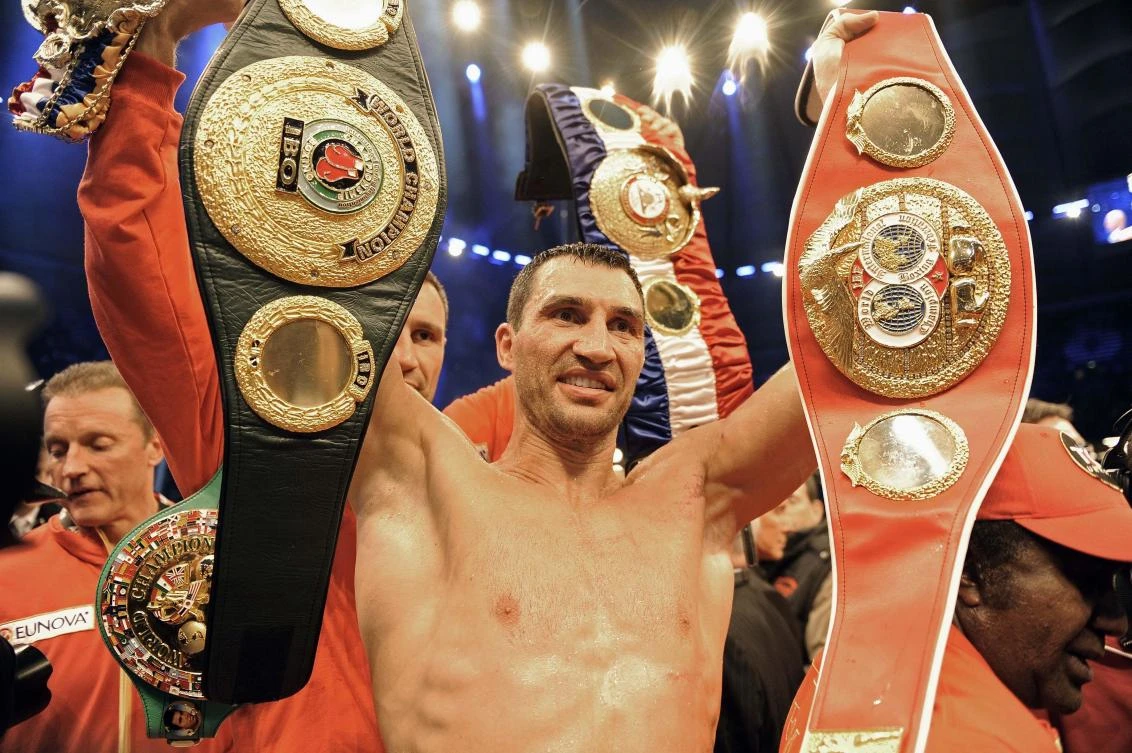 File photo heavyweight world boxing champion Wladimir Klitschko of the Ukraine celebrates with his belts after winning his heavyweight unification title bout against David Haye of Britain in Hamburg, Germany, Former heavyweight world champion Wladimir Klitschko has announced his retirement from boxing. (AP)