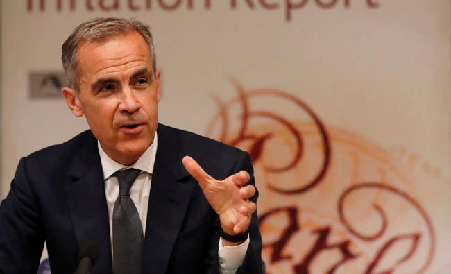 Britain’s Bank of England Governor, Mark Carney, addresses journalists during a press conference to deliver the quarterly inflation report in London on Thursday. (Reuters)