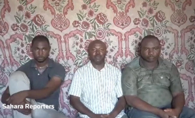 A still image taken from a video released by suspected Boko Haram militants on July 29, shows three kidnapped members of an oil exploration team in northeastern Nigeria. (Reuters)