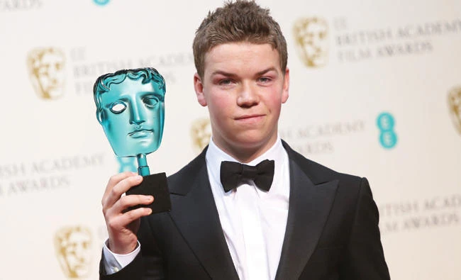 Will Poulter poses with his BAFTA Award in London. (AP)