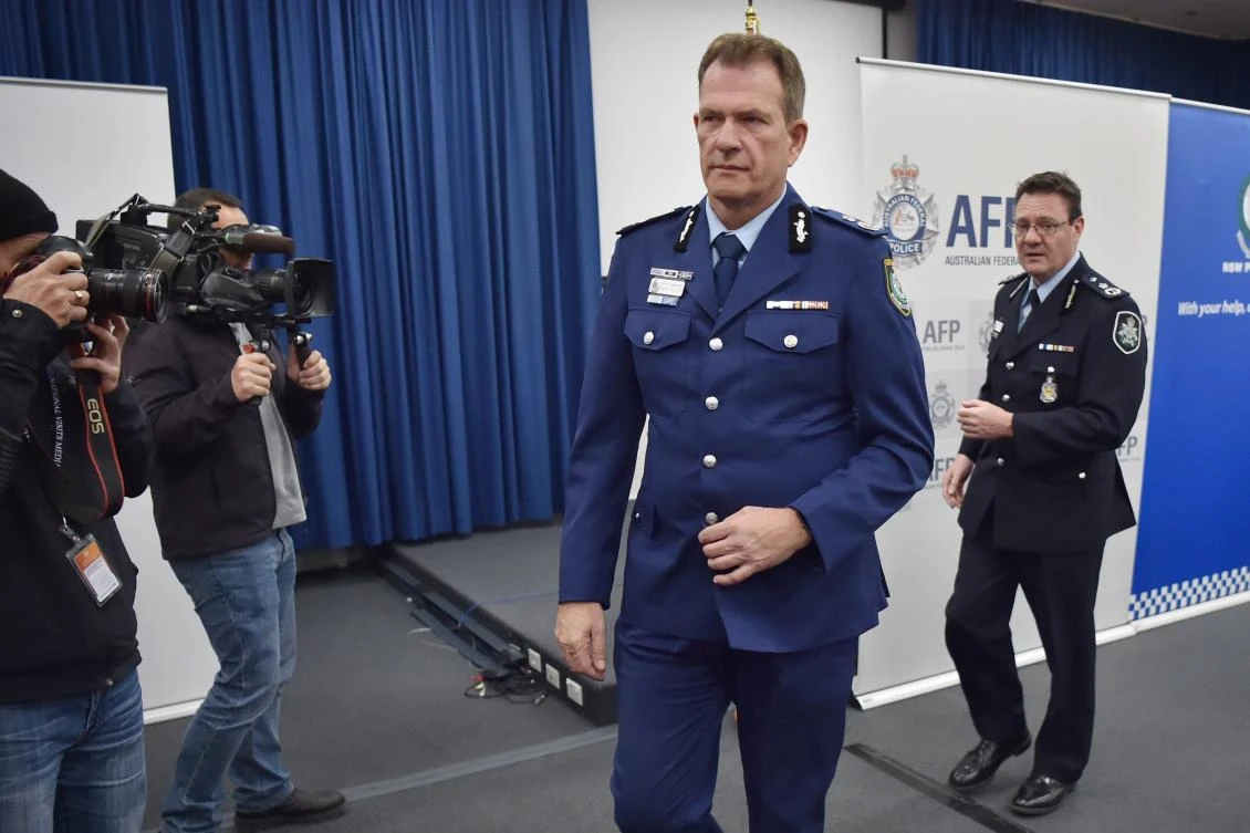 Australian Federal Police Deputy Commissioner Michael Phelan (R) and New South Wales Police Deputy Commissioner David Hudson leave a press conference after addressing the media in Sydney on Friday. (AFP / Peter Parks)