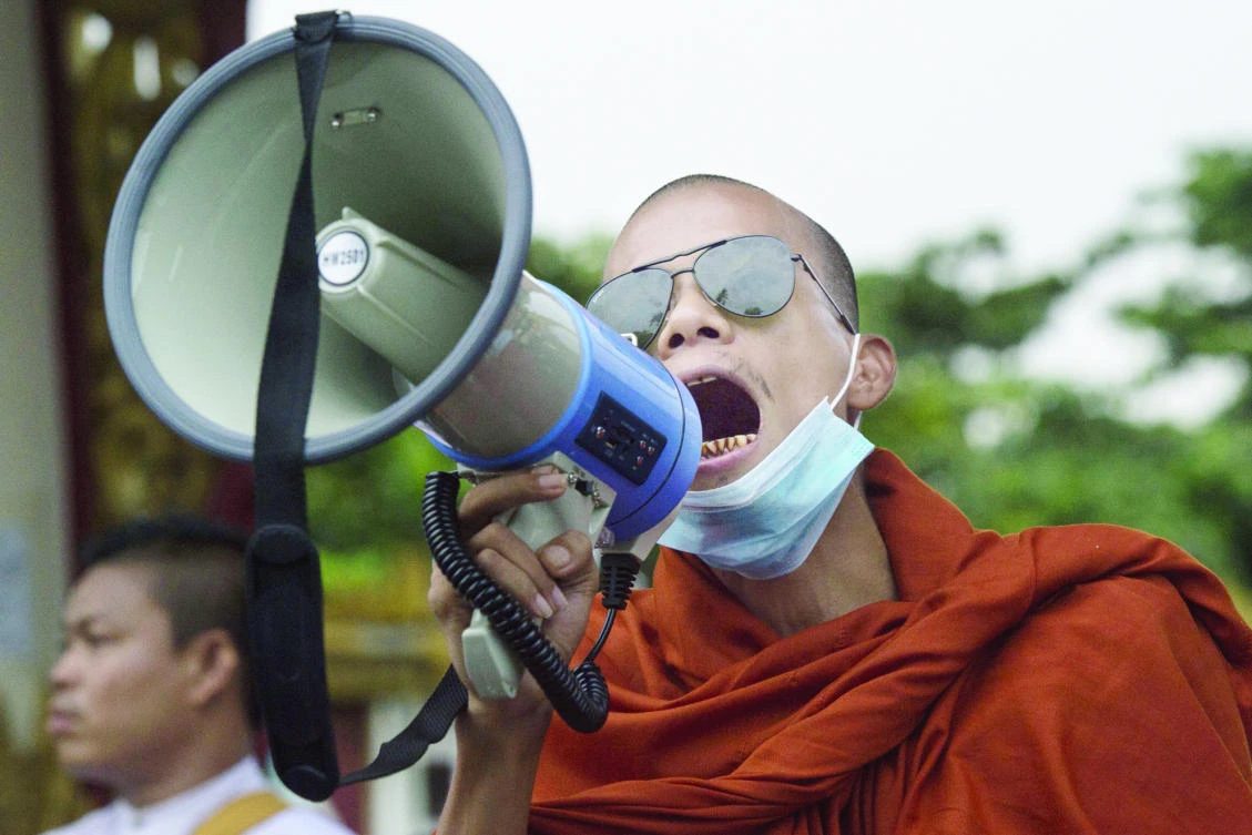 A Buddhist monk shout anti-government slogans during a protest in Yangon on Wednesday. (AFP)