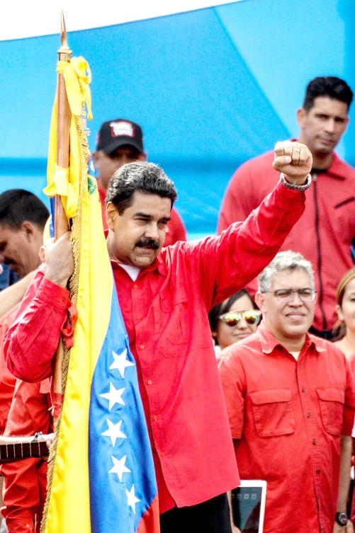 Venezuelan President Nicolas Maduro holds a national flag during the closing of the campaign to elect a Constituent Assembly in this July 27 photo. (AFP)