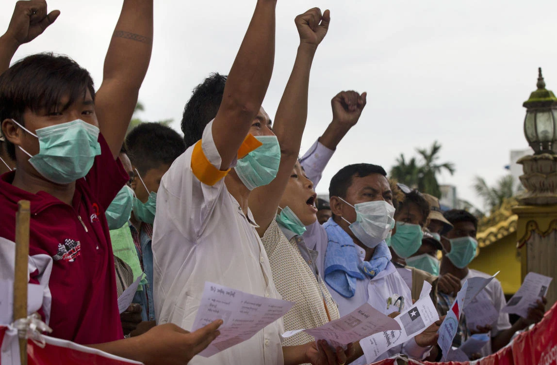 Buddhist nationalists shout slogans during a protest at their camp at entrance of a pagoda Thursday, Aug. 3, 2017, in Yangon, Myanmar. (AP)
