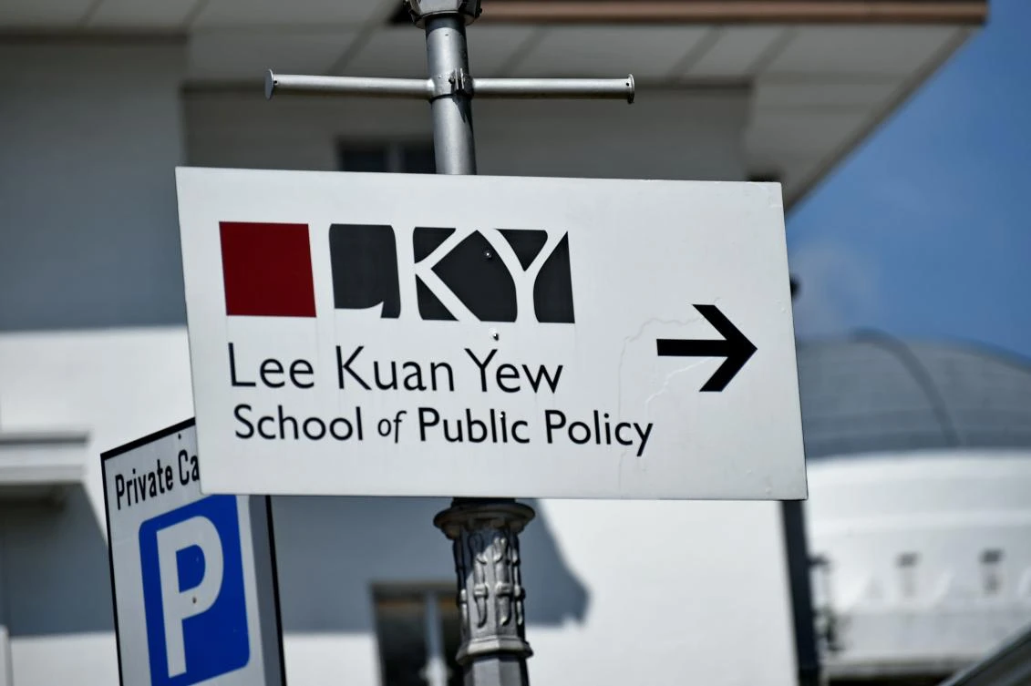 (FILES) This file photo taken on April 16, 2015 shows a sign board pointing towards the Lee Kuan Yew School of Public Policy in Singapore. Singapore said on August 4, 2017 it would expel a professor of Chinese descent working at a local university from the city-state, accusing him of acting as an "agent of influence" for a foreign government. Huang Jing, a US citizen who held a senior position at the Lee Kuan Yew School of Public Policy, had engaged in "activities inimical to Singapore's national interests", said the city-state's Ministry of Home Affairs. (AFP)