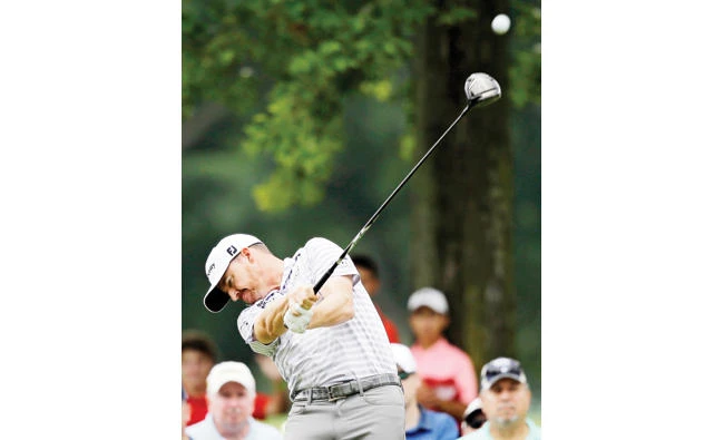 Jimmy Walker tees off on the ninth hole during the second round of the Bridgestone Invitational golf tournament at Firestone Country Club Friday in Akron, Ohio. (AP)