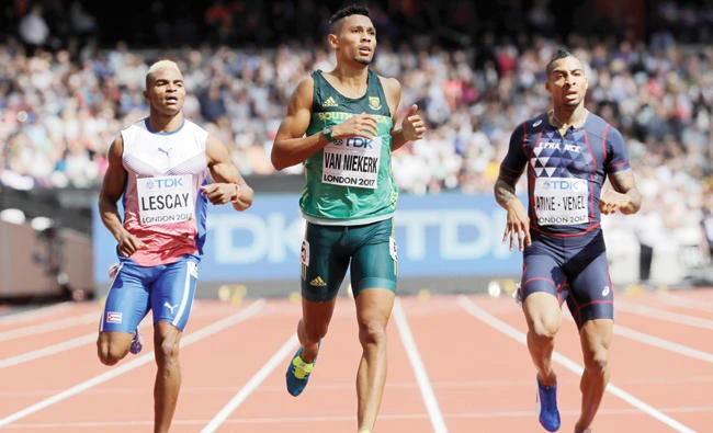 South Africa’s Wayde Van Niekerk, center, eases down to win a men’s 400m first round heat during the World Athletics Championships in London Saturday. (AP)