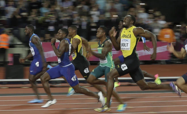 United States' gold medal winner Justin Gatlin, left, US' silver medal winner Christian Coleman, second left, and Jamaica's bronze medal winner Usain Bolt, right, compete during the World Athletics Championships in London on Saturday. (AP Photo/Matt Dunham)