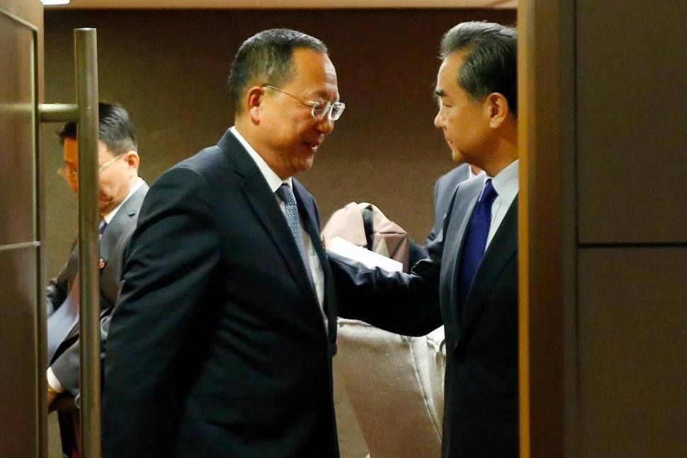 North Korean Foreign Minister Ri Yong Ho, center, bids farewell to his Chinese counterpart Wang Yi, right, following their bilateral meeting in the sidelines of the 50th ASEAN Foreign Ministers' Meeting and its Dialogue Partners Sunday, Aug. 6, 2017 in suburban Pasay city, south Manila, Philippines. Bolstered by new U.N. sanctions, the United States and North Korea's neighbors are joining in a fresh attempt to isolate Pyongyang over its nuclear and missile programs, in a global campaign cheered on by U.S. President Donald Trump. (AP)