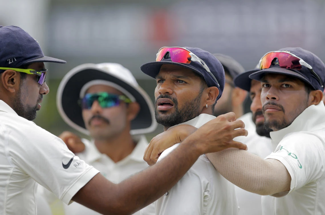 Indian players stand in a huddle before the start of fourth day's play of their second cricket Test match against Sri Lanka in Colombo on Sunday. (AP)