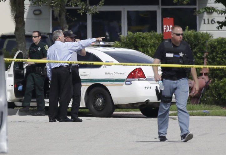 FILE - Law enforcement officials investigate a scene in Florida. (AP)