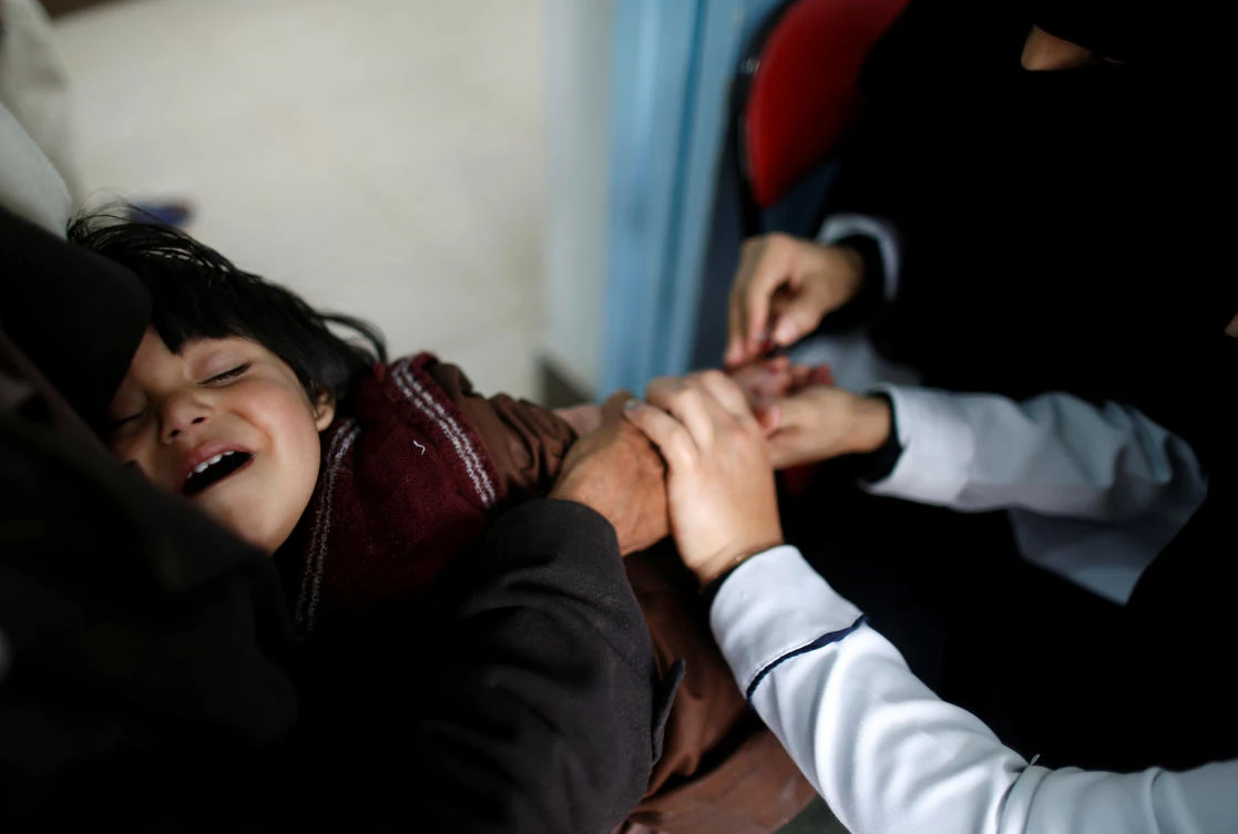 Nurses tend to a boy who is suspected of being infected with cholera at a cholera treatment center in Sanaa, Yemen, May 15, 2017. REUTERS/Khaled Abdullah SEARCH "CHOLERA KHALED" FOR THIS STORY. SEARCH "WIDER IMAGE" FOR ALL STORIES.