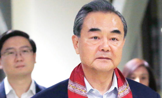 Chinese Foreign Minister Wang Yi arrives to take part in the 50th ASEAN Foreign Ministers' Meeting and its Dialogue Partners, Saturday, in suburban Pasay city south Manila, Philippines. (AP)