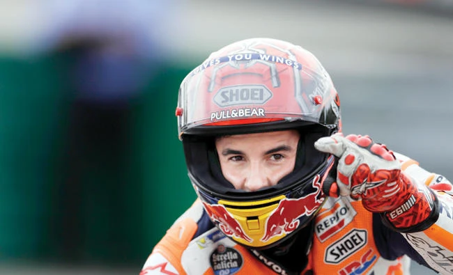 Spain’s MotoGP rider Marc Marquez of the Repsol Honda Team celebrates his victory in the MotoGP race at the Czech Republic motorcycle Grand Prix at the Automotodrom Brno, in Brno, Czech Republic, Sunday. (AP)