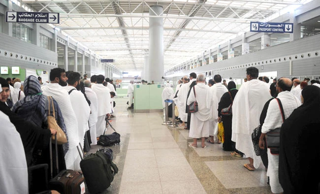 Hajj pilgrims are checked by Passport control officers at King Abdul Aziz International Airport in Jeddah. (AFP)