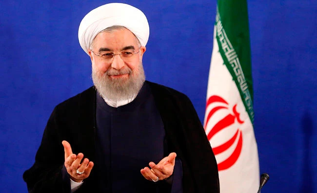 This file photo taken on May 22, 2017 shows Iranian President Hassan Rouhani arriving to hold a press conference in Tehran. (AFP)
