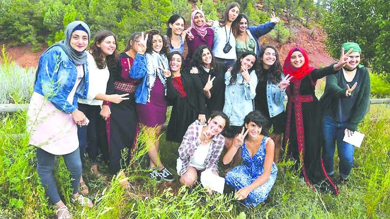 Palestinian and Israeli girls share activities together at the ‘Creativity for Peace’ camp which every year includes up to 20 girls, half Israelis and half Palestinians
from Israel, the West Bank and Gaza. (AFP)