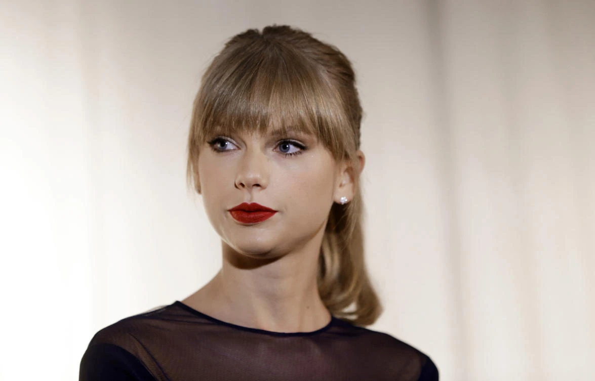 FILE - In this Oct. 12, 2103 file photo, Taylor Swift appears at the Country Music Hall of Fame and Museum in Nashville, Tenn. David Mueller, a former radio host, claims in a lawsuit that he lost his job because Swift falsely accused him of groping her. Swift has countersued, alleging she's the victim of sexual assault. Mueller is seeking up to $3 million in damages at the trial that begins Monday, Aug. 7, 2017, in federal court in Denver. Both sides say no settlement is in the works. (AP Photo/Mark Humphrey, File)