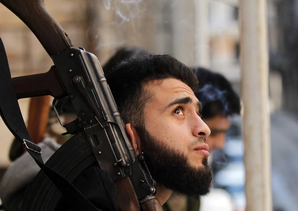 A quiet moment for a Free Syrian Army battalion consisting of high-school graduates and university students, in the Syrian city of Aleppo. (REUTERS)