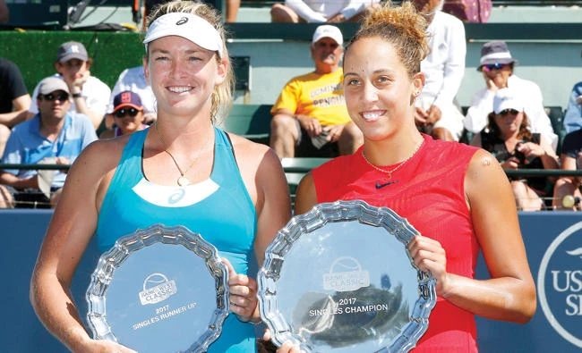 Madison Keys, right, of the US, holds the winner’s plate next to compatriot Coco Vandeweghe with the runner-up plate, after the final in the Bank of the West Classic tennis tournament in Stanford, Calif., Sunday. (AP)
