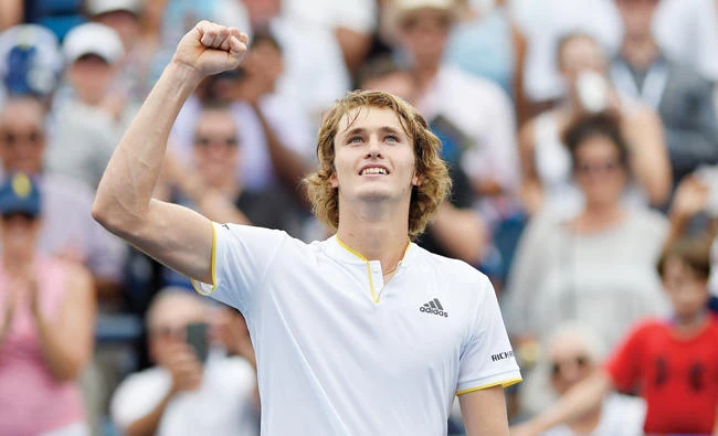 Alexander Zverev, of Germany, pumps his fist to the crowd as he celebrates his win over Kevin Anderson, of South Africa, in the finals of the Citi Open tennis tournament Sunday. Zverev won 6-4, 6-4. (AP)