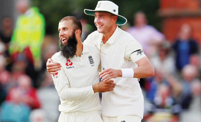 England’s Moeen Ali celebrates taking the wicket of South Africa’s Duanne Olivier and winning the match with Stuart Broad. (Reuters)