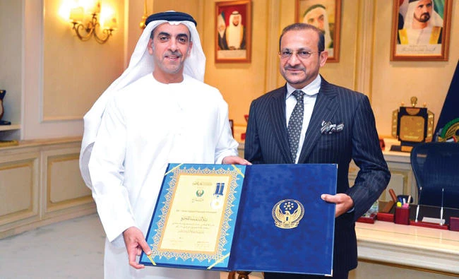 Sheikh Saif bin Zayed Al-Nahyan, the UAE’s deputy prime minister and interior minister, presents the award to Firoz Merchant.