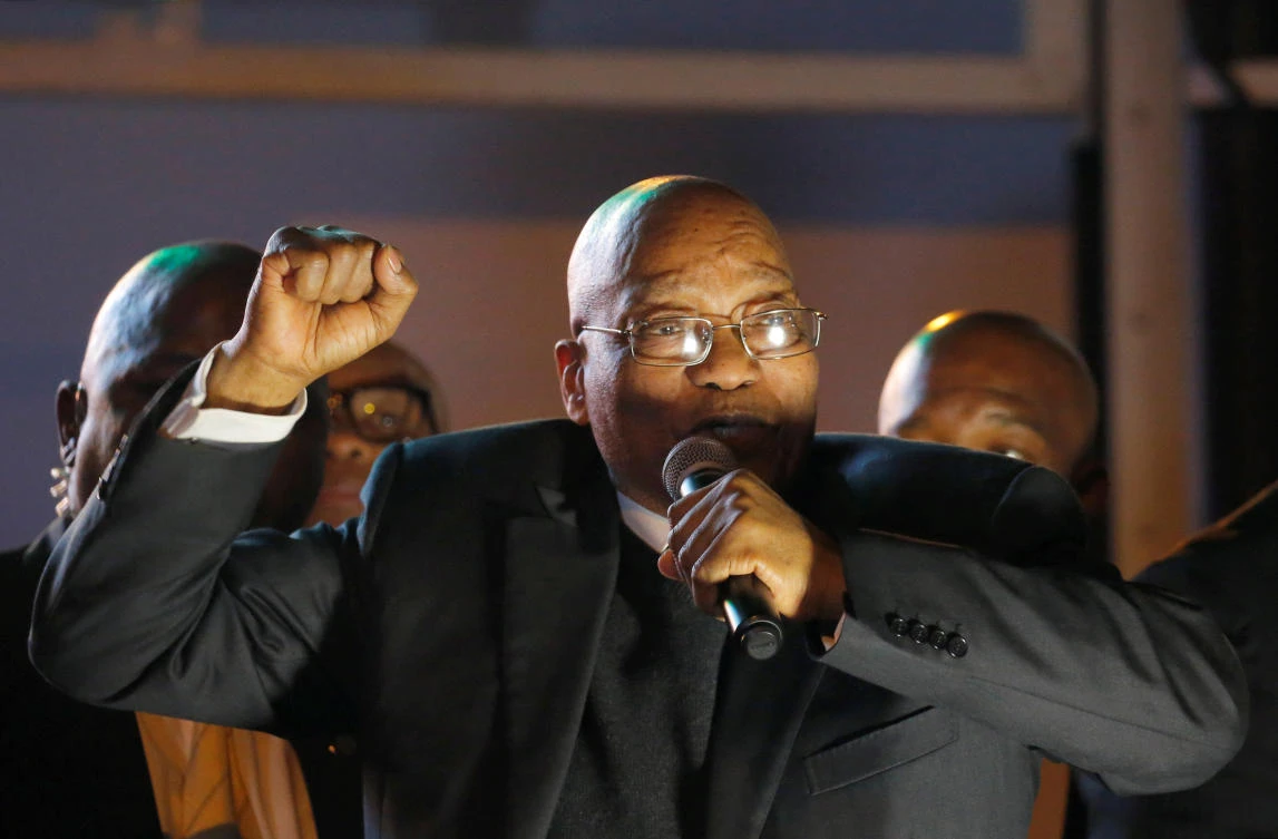 South Africa's President Jacob Zuma celebrates with his supporters after he survived a no-confidence motion in parliament in Cape Town, South Africa, on Tuesday. (REUTERS/Mike Hutchings)