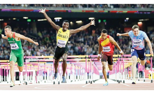 Jamaica’s Omar Mcleod, second left, celebrates as he wins the gold medal in the final of the men’s 110-meter hurdles during the World Athletics Championships in London Monday night. At right is Russia’s Sergey Shubenkov, who took silver, and at left is Hungary’s Balazs Baji
who took the bronze. (AP)