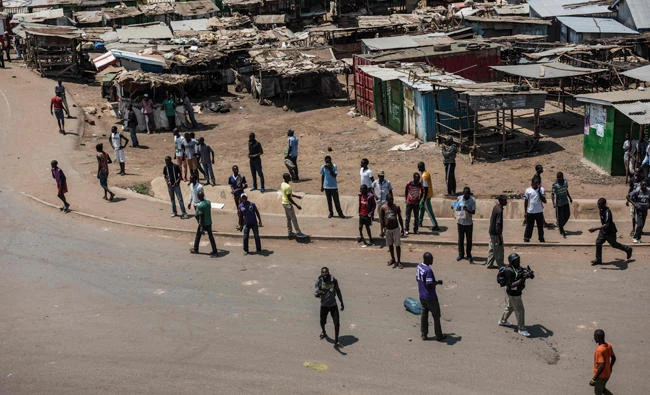 Supporters of Kenya's opposition alliance, National Super Alliance (NASA) presidential candidate, Raila Odinga, protest in a street in Kisumu's Kondele estate on Wednesday after the announcement of national election results. Riot police engaged in running battles Wednesday with protesters in the opposition stronghold of Kisumu in western Kenya, as presidential aspirant Raila Odinga claimed massive poll fraud, an AFP reporter witnessed. (AFP)