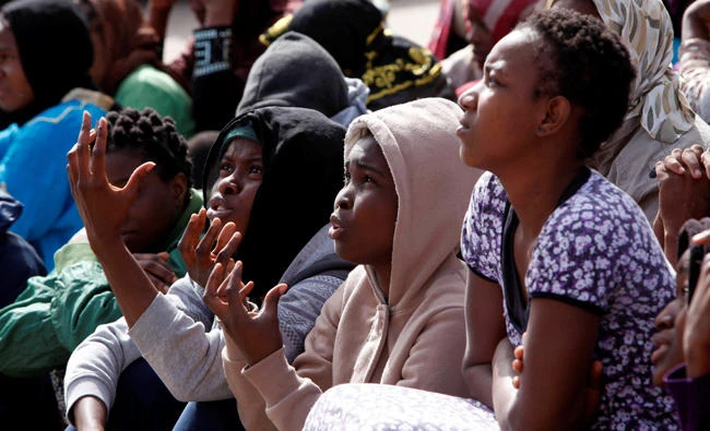 African migrants sit in a detention camp in Tripoli in this file photo. (Reuters)