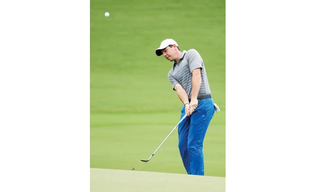 Rory McIlroy, of Northern Ireland, chips to the 18th green during a practice round at the PGA Championship golf tournament at the Quail Hollow Club
Tuesday in Charlotte, N.C. (AP)