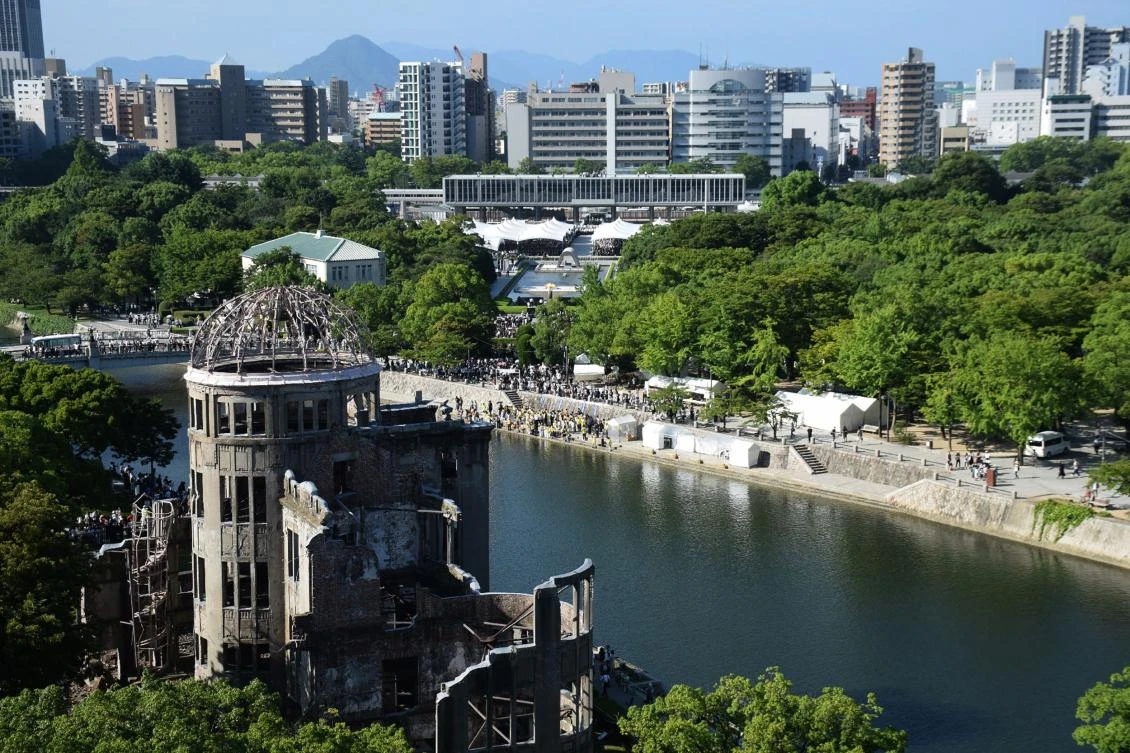 This overhead view shows the Hiroshima Atomic Bomb dome (front L) and Peace Memorial Park (C) as people attend the 72nd anniversary memorial service for the atomic bomb victims in Hiroshima on August 6, 2017. A US B-29 plane dropped a bomb over the city at 8:15am on August 6, 1945, marking the first use of an atomic weapon which ultimately claimed the lives of some 140,000 people. (AFP)