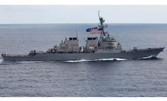 In this file photo, the USS John S. McCain (DDG-56) destroyer sails off the coast of Vietnam. A Navy official says the USS John S. McCain has sailed close to a Chinese man-made island in a freedom of navigation operation in the disputed South China Sea. (AP)