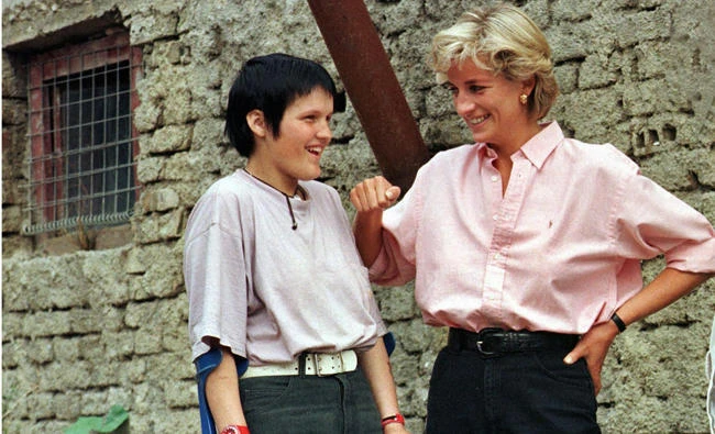 In this file photo, Britain's Diana, Princess of Wales (R) chats with Bosnian muslim girl Mirzeta Gabelic, a 15 year-old landmine victim in Sarajevo, while Diana was on a visit to the region as part of her campaign against landmines. Bosnia is marking Thursday, Aug. 10, 2017, the 20th anniversary of Princess Diana's visit, her last overseas tour only weeks before she died in a car crash in Paris. (AP)
