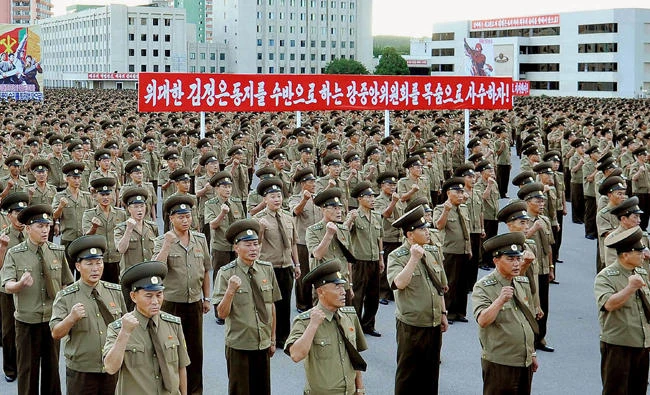This picture taken on August 10, 2017 and released by North Korea's official shows service personnel of the Ministry of People's Security at a rally in Pyongyang in support of North Korea's stance against the US. (Korean Central News Agency via AFP)
