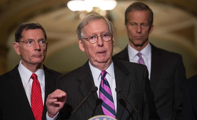 This file photo taken on August 01, 2017 shows US Senate Majority Leader Mitch McConnell speaking to the press with partymates after the Republican senators' weekly lunch at the US Capitol in Washington, DC. (AFP / Nicholas Kamm)