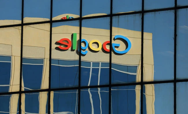 The Google logo is shown reflected on an adjacent office building in Irvine, California, on August 7, 2017. (REUTERS/Mike Blake)