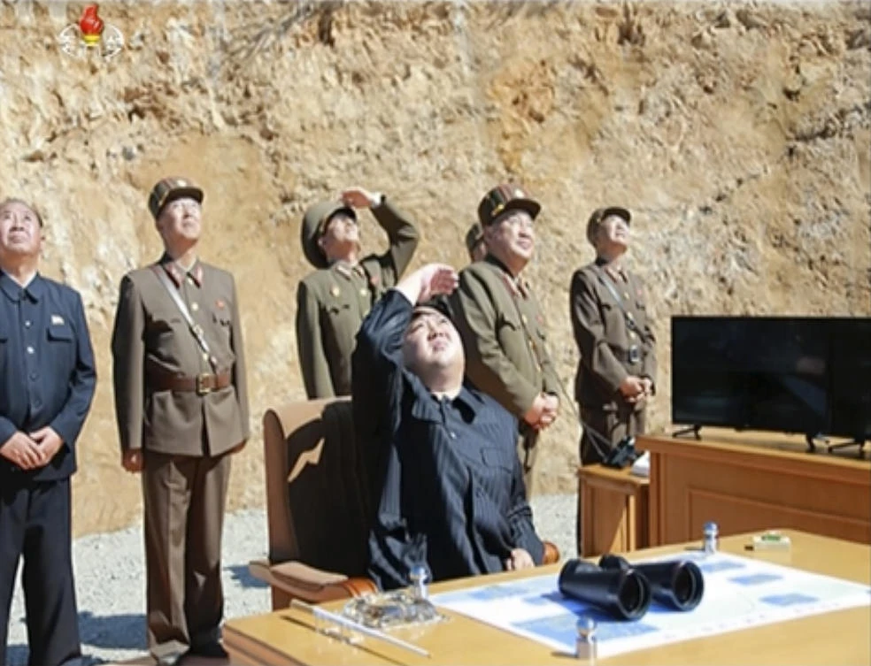 Image made from video of a news bulletin aired by North Korea’s KRT on July 4, 2017, shows what was said to be North Korea leader Kim Jung Un, center, watching the launch of a Hwasong-14 intercontinental ballistic missile, ICBM, in North Korea’s northwest. (KRT via AP Video, File)