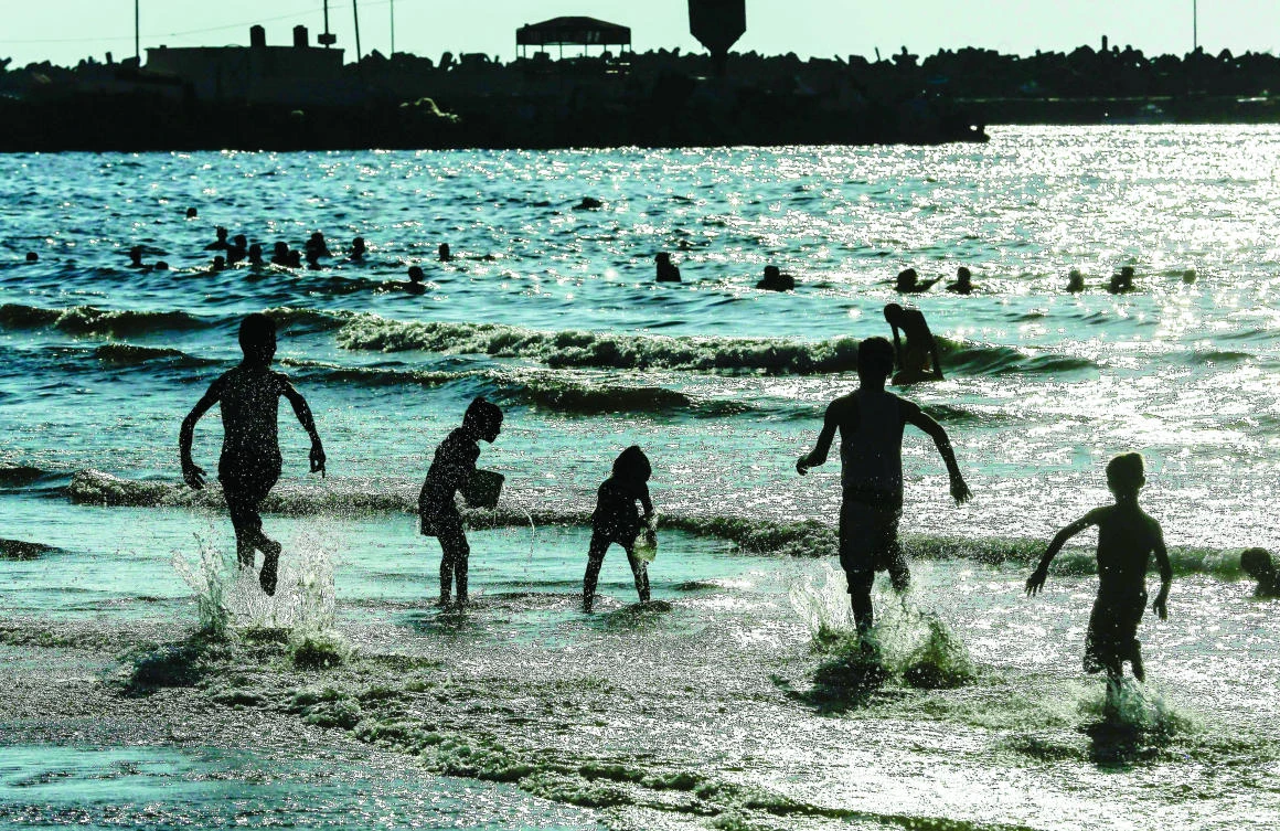 Palestinian children play on the beach in Gaza City on Thursday. (AFP)