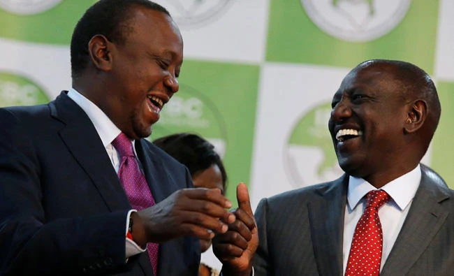 Incumbent President Uhuru Kenyatta celebrates with Deputy President William Ruto after he was announced winner of the presidential election at the IEBC National Tallying centwe at the Bomas of Kenya, in Nairobi, on Friday. (REUTERS/Thomas Mukoya)