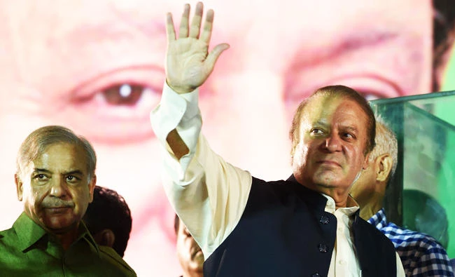 Ousted Pakistani Prime Minister Nawaz Sharif gestures as he addresses supporters at a rally after reaching his home city of Lahore on Saturday. (AFP)