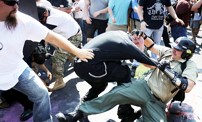 White nationalists, neo-Nazis and members of the "alt-right" clash with counter-protesters as they enter Lee Park during the "Unite the Right" rally on Saturdy in Charlottesville, Virginia. (AFP)